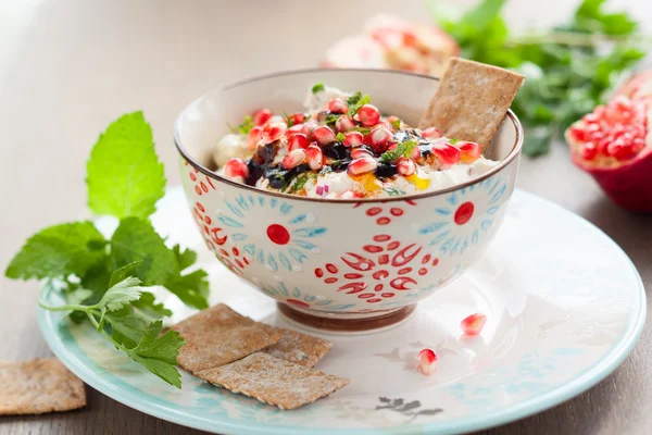 Cheese dip with pomegranate seeds — Stock Photo, Image