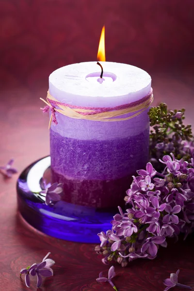 Candle and lilac — Stock Photo, Image