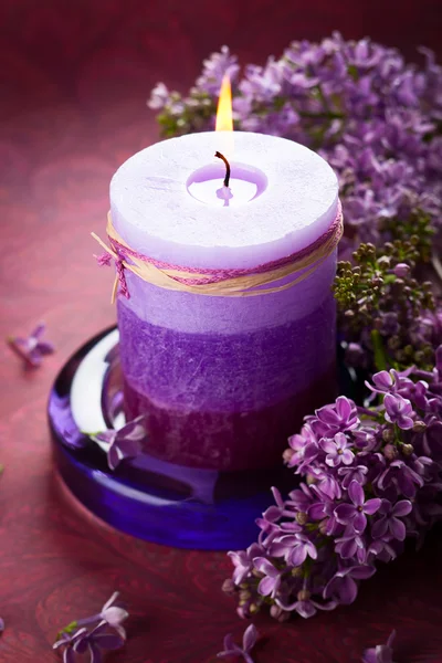 Candle and lilac — Stock Photo, Image