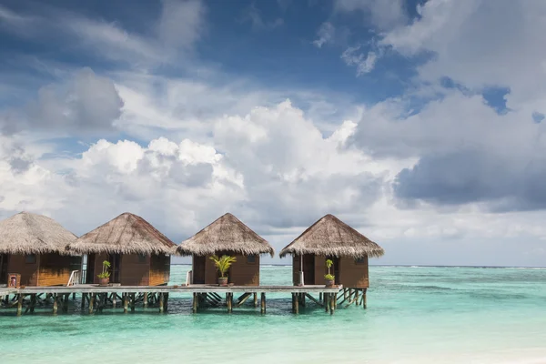 Small wooden houses on sea — Stock Photo, Image