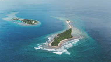 Two tropic Islands in Maldives region clipart