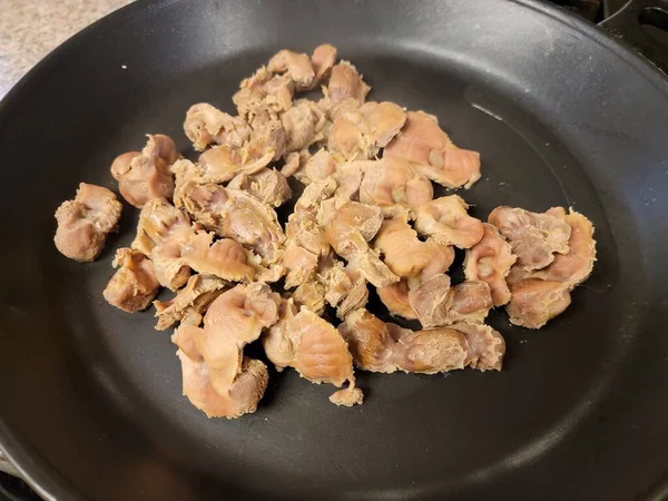 Chicken gizzard meat in frying pan or skillet — Stock Photo, Image