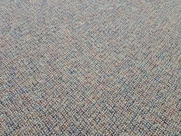 Grey and brown carpet or rug on floor or ground — Stock Photo, Image