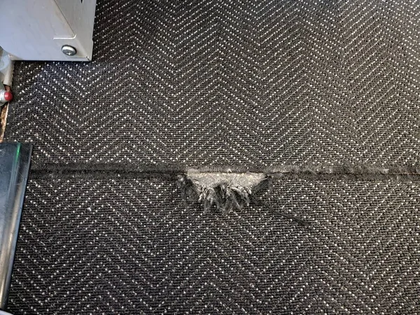 Torn Worn Black Carpet Rug Floor Airplane — Stock Photo, Image