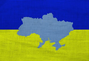 Flag and map of Ukraine on a sackcloth clipart