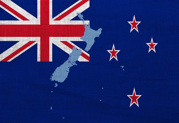 Flag and map of New Zealand on a sackcloth — Stock Photo, Image