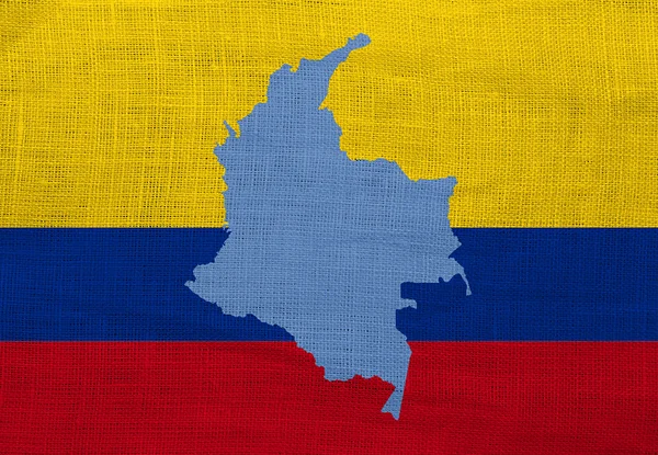 Flagga och karta över colombia på en säckväv — Stockfoto