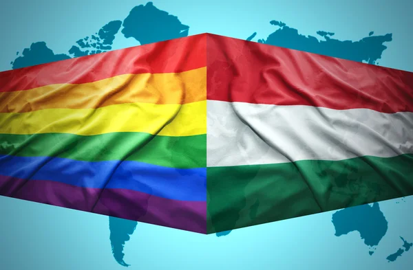 Waving Hungarian and Gay flags — Stock Photo, Image