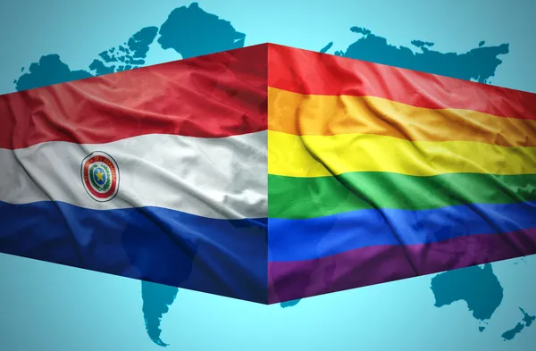 Waving Paraguayan and Gay flags — Stock Photo, Image