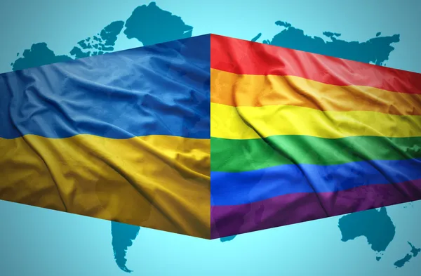 Waving Ukrainian and Gay flags — Stock Photo, Image