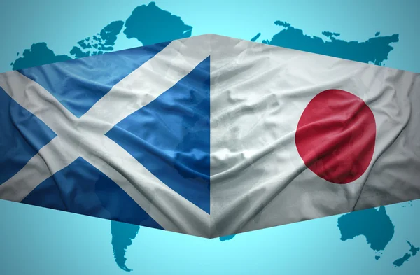 Schotse en Japanse vlaggen te zwaaien — Stockfoto