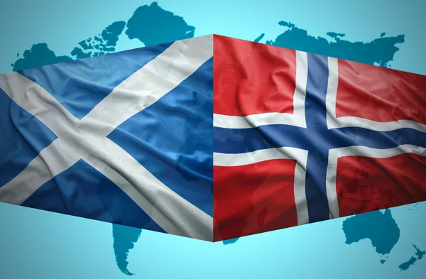 Waving Scottish and Norwegian flags — Stock Photo, Image