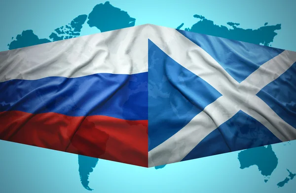Waving Scottish and Russian flags — Stock Photo, Image