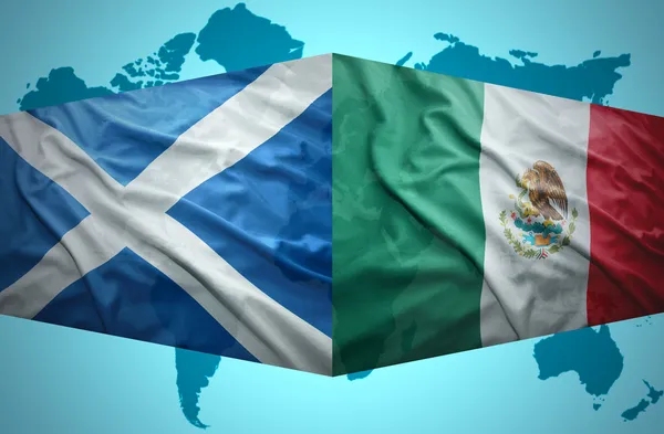 Waving Scottish and Mexican flags — Stock Photo, Image