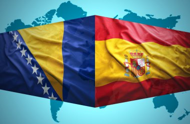 wuivende Bosnische en de Spaanse vlaggen