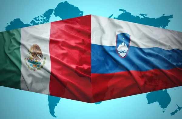 Waving Slovenian and Mexican flags — Stock Photo, Image