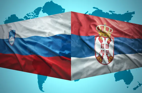 Waving Slovenian and Serbian flags — Stock Photo, Image
