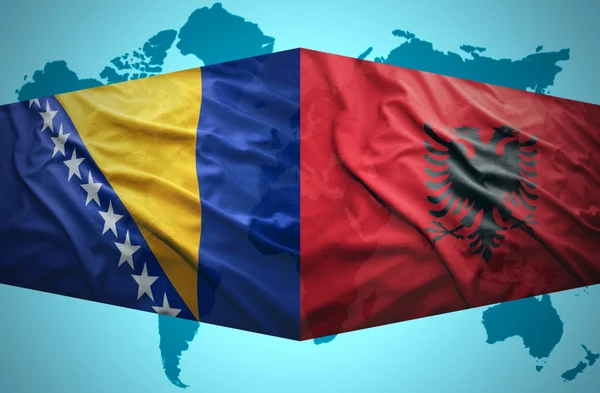 Waving Albanian and Bosnian flags — Stock Photo, Image