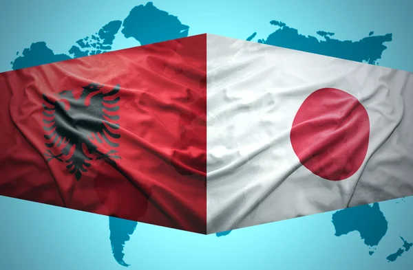Arnavut ve Japon bayrakları sallayarak — Stok fotoğraf