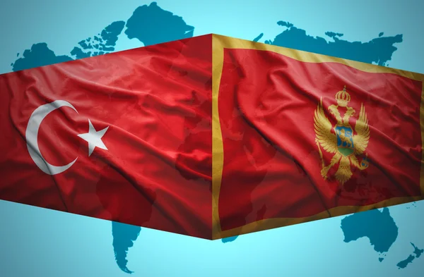 Waving Montenegrin and Turkish flags — Stock Photo, Image