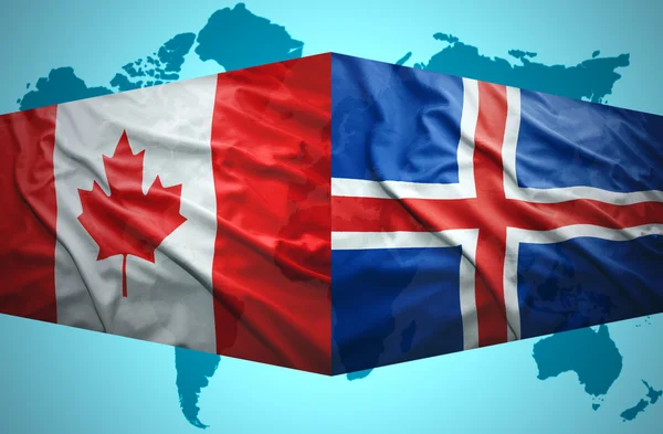 Waving Icelandic and Canadian flags — Stock Photo, Image
