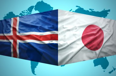 İzlanda ve Japon bayrakları sallayarak