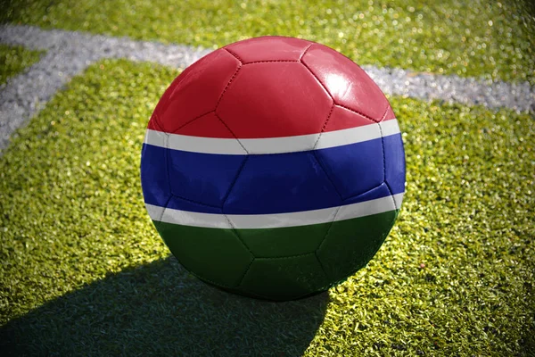Футбольный Мяч Национальным Флагом Гамбии Лежит Зеленом Поле Рядом Белой — стоковое фото