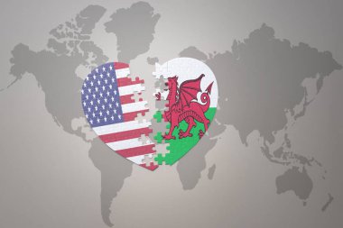 Amerika Birleşik Devletleri ve Galler 'in ulusal bayrağıyla bir dünya haritası arka planında bulmaca kalbi. Kavram. 3B illüstrasyon