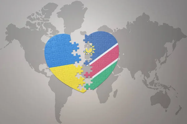 世界地図の背景にウクライナとナミビアの国旗が描かれたパズルハートです コンセプト 3Dイラスト — ストック写真