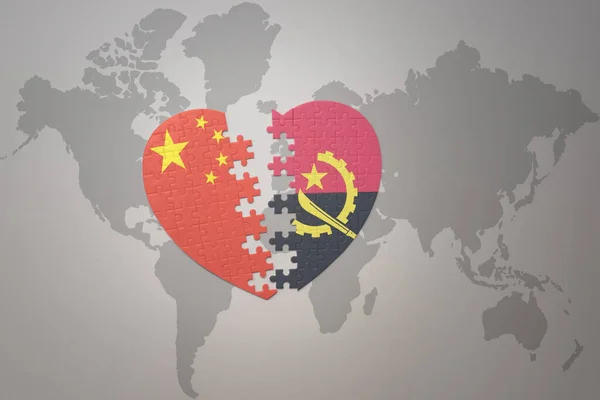 puzzle heart with the national flag of china and angola on a world map background. Concept. 3D illustration