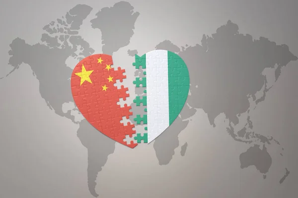 puzzle heart with the national flag of china and nigeria on a world map background. Concept. 3D illustration