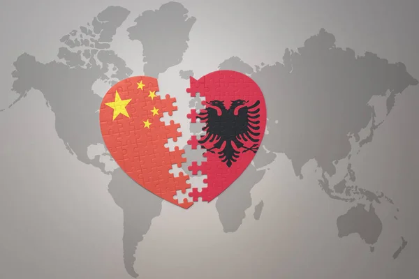 puzzle heart with the national flag of china and albania on a world map background. Concept. 3D illustration