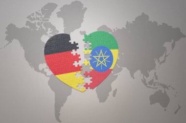 Dünya haritasında Etiyopya ve Almanya 'nın ulusal bayrağı olan bir bulmaca kalbi. Kavram. 3B illüstrasyon