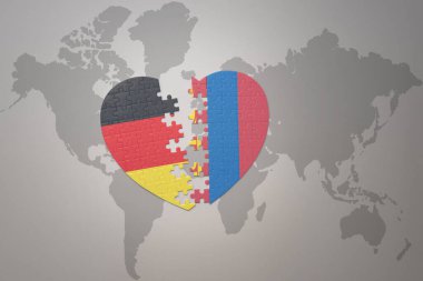 Dünya haritasında Moğolistan ve Almanya 'nın ulusal bayrağını taşıyan bir yapboz kalbi. Kavram. 3B illüstrasyon