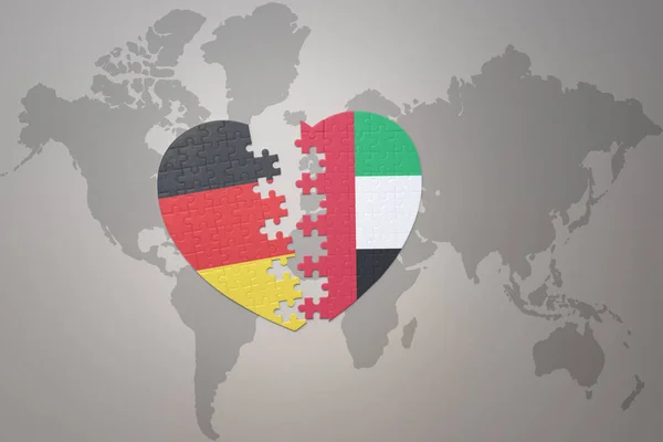 在世界地图的背景上 用统一的阿拉伯酋长国和德国国旗拼凑人心 3D插图 — 图库照片