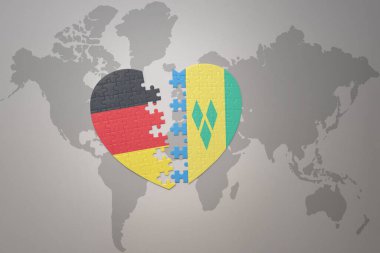 Aziz Vincent 'in ulusal bayrağının, el bombalarının ve Almanya' nın dünya haritasının arka planında yer alan yapboz kalbi. Kavram. 3B illüstrasyon