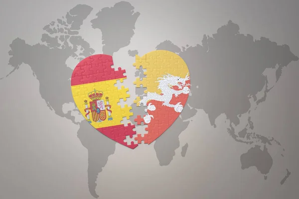 Serce Puzzle Flagą Narodową Bhutanu Hiszpanii Tle Mapy Świata Koncepcja — Zdjęcie stockowe