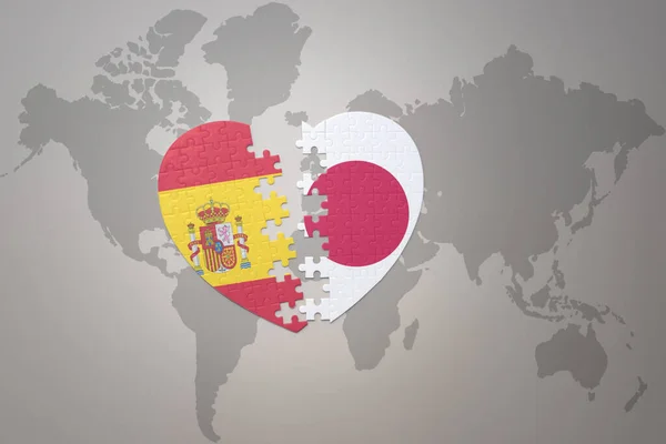 在世界地图的背景上 用日本国旗和西班牙国旗拼凑人心 3D插图 — 图库照片