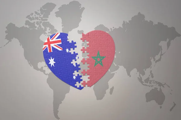 世界地図の背景にモロッコとオーストラリアの国旗が描かれたパズルハートです コンセプト 3Dイラスト — ストック写真