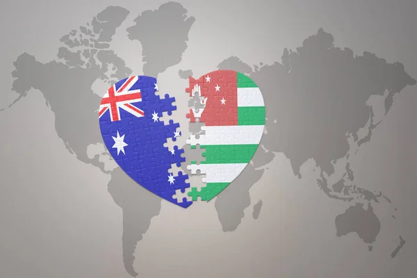 パズルハートで世界地図の背景にアブハジアとオーストラリアの国旗が描かれています コンセプト 3Dイラスト — ストック写真