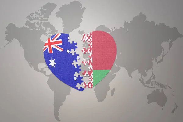 世界地図の背景にベラルーシとオーストラリアの国旗が描かれたパズルハートです コンセプト 3Dイラスト — ストック写真
