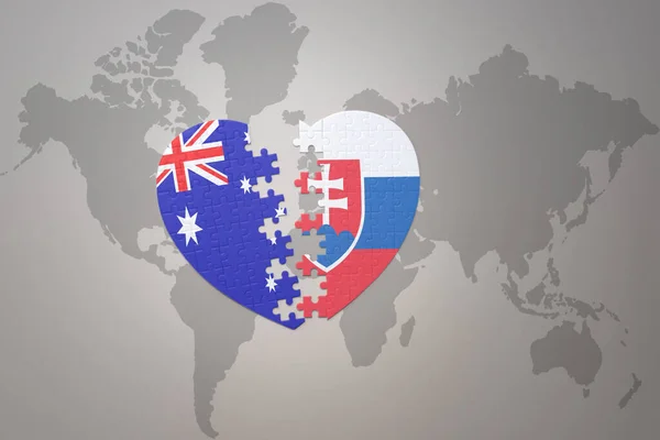 世界地図の背景にスロバキアとオーストラリアの国旗が描かれたパズルハートです コンセプト 3Dイラスト — ストック写真