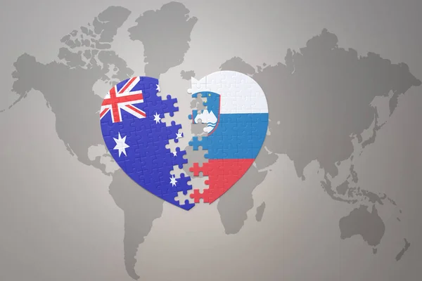 世界地図の背景にスロベニアとオーストラリアの国旗が描かれたパズルハートです コンセプト 3Dイラスト — ストック写真