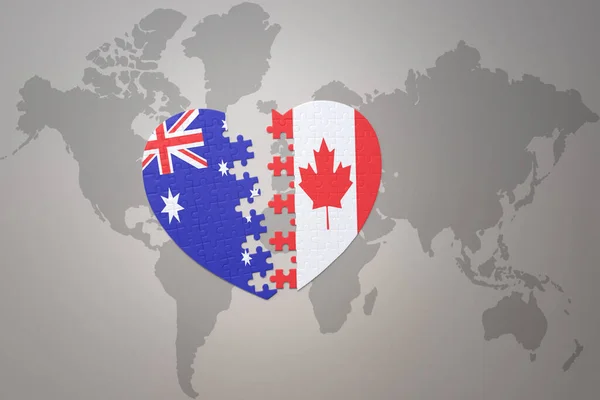 世界地図の背景にカナダとオーストラリアの国旗が描かれたパズルハートです コンセプト 3Dイラスト — ストック写真