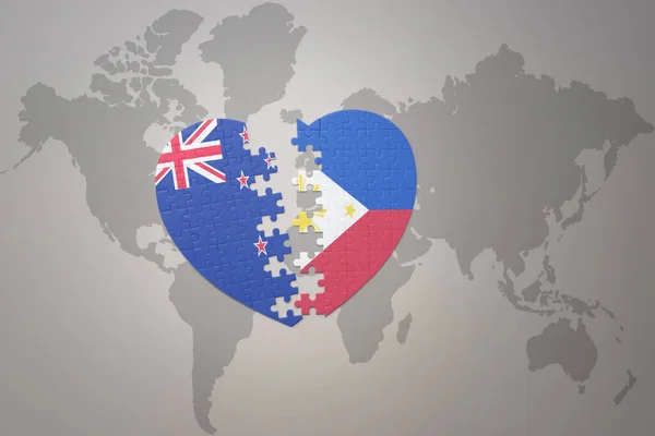 世界地図の背景にニュージーランドとフィリピンの国旗が描かれたパズルハートです コンセプト 3Dイラスト — ストック写真