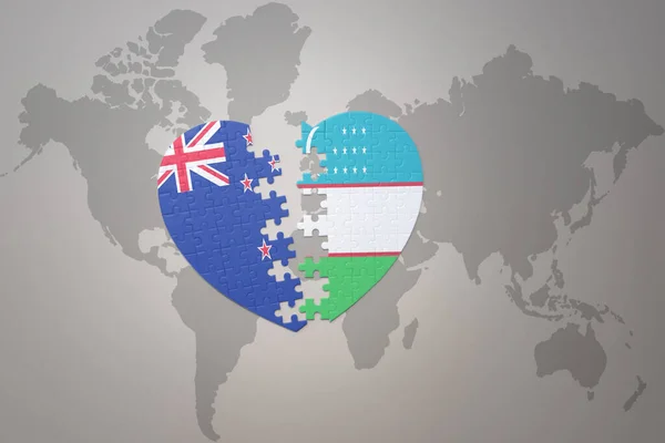 世界地図の背景にニュージーランドとウズベキスタンの国旗が描かれたパズルハートです コンセプト 3Dイラスト — ストック写真