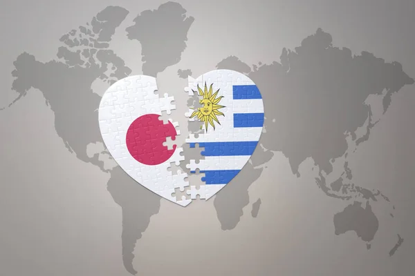 Puzzle Srdce Národní Vlajkou Japonska Uruguay Pozadí Mapy Světa Koncept — Stock fotografie