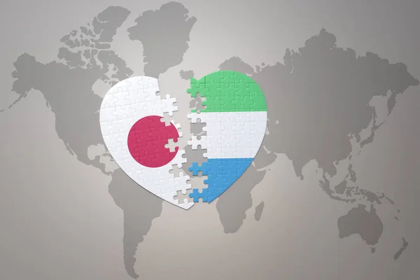 パズルハートで日本の国旗とシエラ レオンを世界地図の背景に コンセプト 3Dイラスト — ストック写真