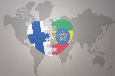 Dünya haritasının arka planında Etiyopya ve Finlandiya 'nın ulusal bayrağı olan bir yapboz kalbi. Kavram. 3B illüstrasyon