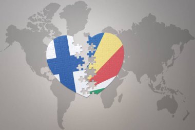 Dünya haritasının arka planında Seyşeller ve Finlandiya 'nın ulusal bayrağı olan bir yapboz kalbi. Kavram. 3B illüstrasyon